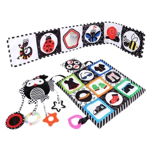 High contrast black and white baby cloth book with owl rattle and teething mirror