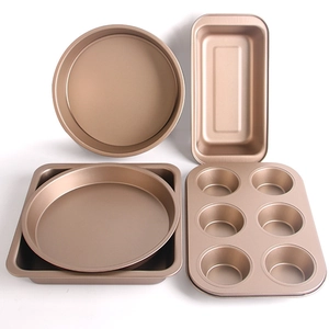 Detail of rose gold non-stick carbon steel baking set with round, square and muffin pans