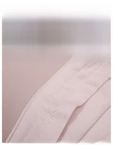Detailed macro shot of the wide sweatband and breathable fabric on pink visor hat