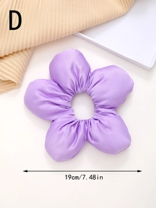 Detailed view of a purple satin flower scrunchie measuring 19cm in diameter