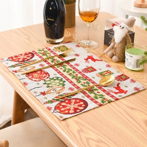 Detailed Christmas table mat with reindeer and pine needle print on woven fabric