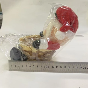 Detail of Santa plush candy basket measuring approximately 18.5cm with woven base