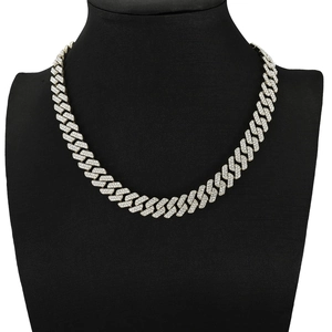 Silver iced out Cuban link chain necklace for men on a black jewelry bust display