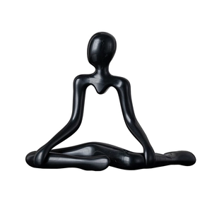 Minimalist black abstract sculpture of a meditating figure for creative home art decor