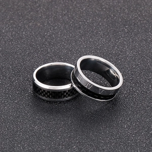 Macro detail of 8mm stainless steel rings featuring carbon fiber inlay and Roman numerals