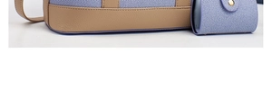 Detailed macro view of purple textured fabric and beige leather base on a tote bag