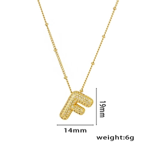 Detail of 18K gold plated letter F pendant with dimensions 19mm x 14mm and 6g weight