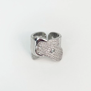 Macro shot of silver belt buckle ring featuring quilted texture and pavé crystals