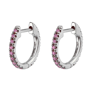 Detailed close-up of silver-tone hoop earrings with pink zircons and 14K engraving