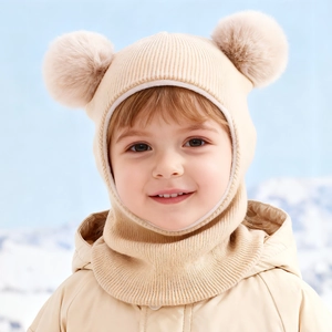 Cute kids beige knitted balaclava hood with double faux fur pom poms for winter warmth