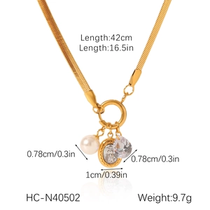 Detail view of gold blade chain with pearl and crystal pendants including size measurements