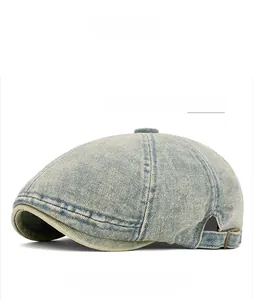 Detailed texture of vintage medium blue washed denim beret with reinforced stitching