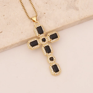 Cross necklace in 18K gold finish with black cubic zirconia and clear rhinestones