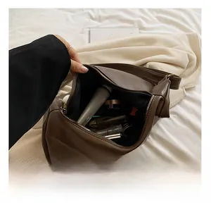 Detailed interior of the vintage brown tote showing spacious capacity for cosmetics