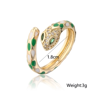 Detail of 18k gold plated snake ring showing green enamel scales and 1.8cm diameter