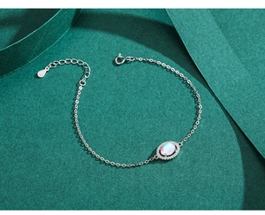 Macro detail of S925 sterling silver opal bracelet with extension chain and spring clasp