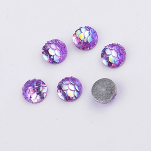 Macro detail of 8mm purple fish scale resin cabochons with iridescent AB finish and flat back