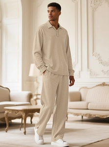 Detail of men's beige knitted polo set showing luxury diamond texture and relaxed fit
