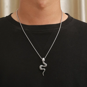 3D silver snake pendant necklace for men in punk gothic style on a male model