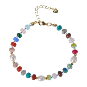 Detail of colorful beads and freshwater pearls necklace with gold heart charm and clasp