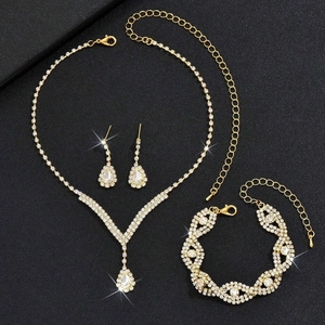 Detailed view of luxury gold bridal jewelry set with sparkling zircon water drop necklace