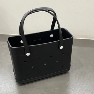 Detail view of a black lightweight EVA beach tote bag with perforated DIY holes