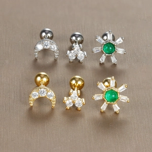 Snowflake and moon zircon ear studs set in gold and silver finish with screw ball back