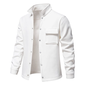 Detail of white waffle texture jacket featuring metallic snap buttons and chest pocket