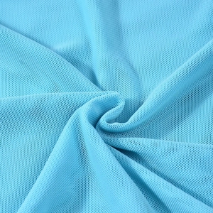 Close-up of light blue mesh fabric texture showing breathable netting detail