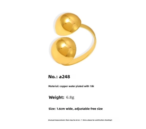 Macro detail of 18k gold plated open ring showing dimensions and dual-ball design