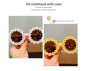 Detail of white and yellow sunflower daisy frame sunglasses with dark lenses for kids