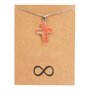 Collier avec pendentif croix en pierre rose et chaîne argentée sur carte d'amitié