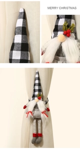 Detail of Christmas buffalo plaid gnome curtain tieback with long legs and plush beard