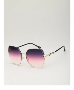 Detail of purple-pink gradient frameless sunglasses with golden metal hinges and accents