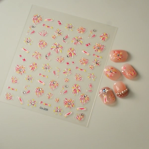 Macro detail of 3D firework nail stickers with rhinestones and pink gradient nail samples