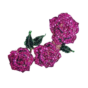 Luxurious rose flower brooch with deep pink crystals and green rhinestone leaves