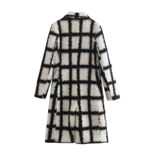 Back view of a long plaid coat with black and white windowpane pattern in textured fleece