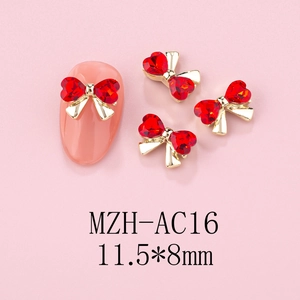 Red heart-shaped crystal bow nail charm with gold base, size 11.5x8mm, model MZH-AC16