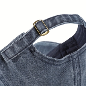 Rear view of vintage washed baseball cap featuring a bronze adjustable metal buckle