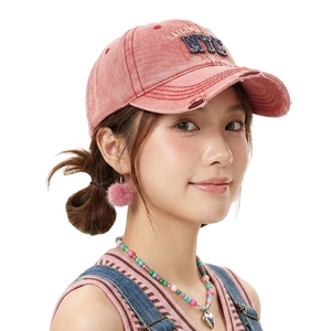 Pink washed distressed denim baseball cap with NYC embroidery and worn edge brim