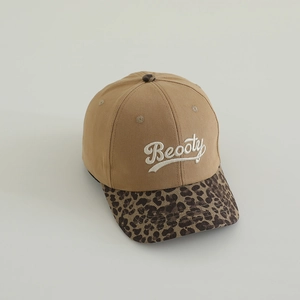 Detail of Beooty letter embroidery on leopard print brim baseball cap for kids