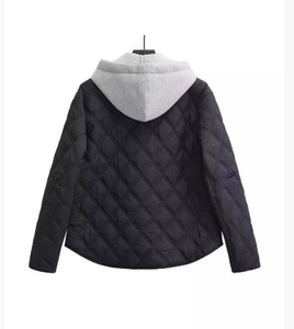 Back view of black quilted jacket with grey hood featuring diamond pattern and casual style