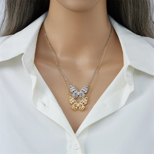 Elegant butterfly pendant necklace with zircon stones in gold and silver finish on model