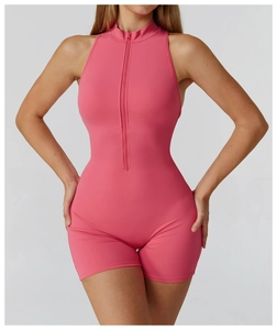 Detailed view of mauve one-piece athletic romper with front zipper and sleeveless halter neck