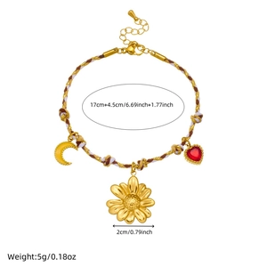 Bohemian woven knot bracelet with gold sunflower, moon, and heart pendants on white background