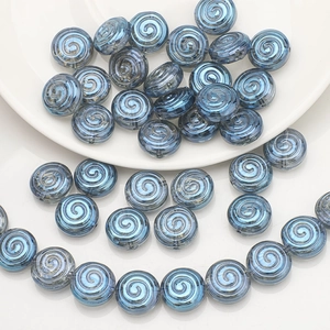 Close-up of blue spiral texture glass beads for DIY jewelry and handmade bracelets