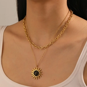 Gold-plated stainless steel layered necklace with sun pendant and black tiger eye stone