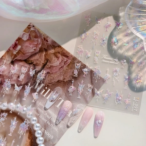 Iridescent butterfly and floral nail stickers with laser effect on pastel gradient nails