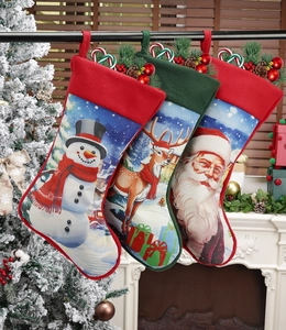 Three-piece Christmas stockings set featuring Santa, reindeer, and snowman hanging by a fireplace