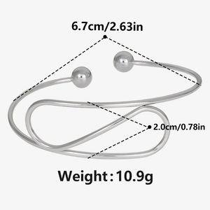 Detailed view of silver stainless steel cuff bracelet with 6.7cm diameter size measurement